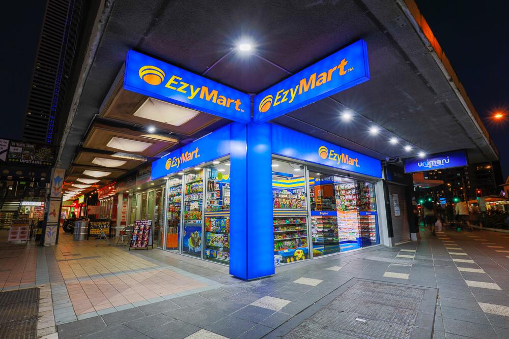Storefront featuring a blue sign installed by commercial electricians, inviting customers with its vibrant color and welcoming appearance.